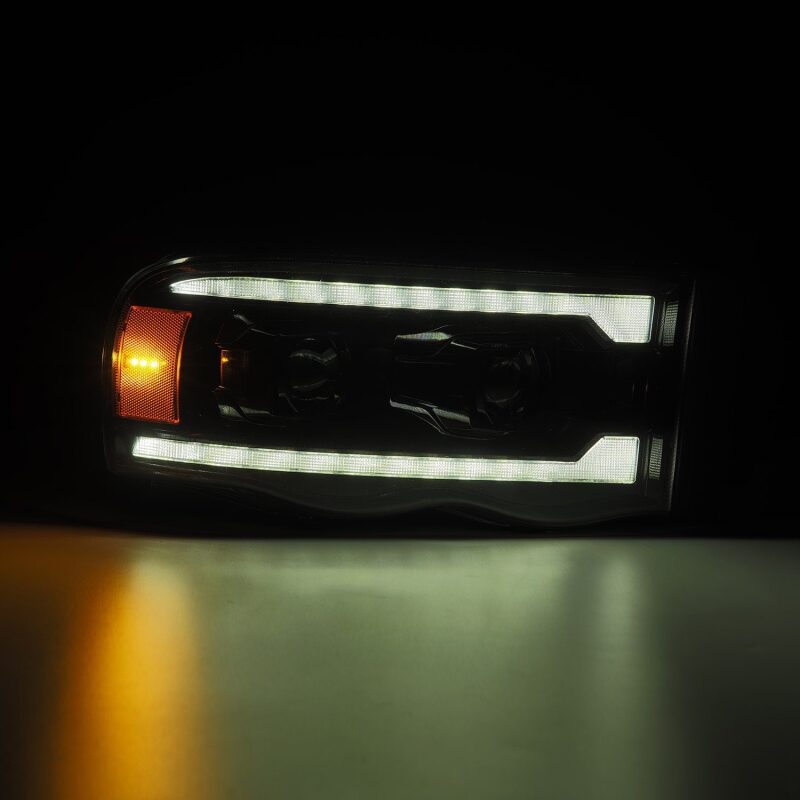 AlphaRex 02-05 Dodge Ram 1500 LUXX LED Proj Headlights Alpha Black w/Activ Light/Seq Signal - B2B Diesel & Gas Service