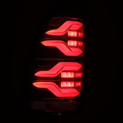 AlphaRex 05-15 Toyota Tacoma LUXX LED Taillights Alpha Blk w/Activ Light/Seq Signal - B2B Diesel & Gas Service