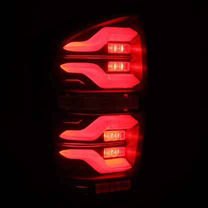 AlphaRex 16-21 Toyota Tacoma LUXX LED Taillights Blk w/Activ Light/Seq Signal - B2B Diesel & Gas Service