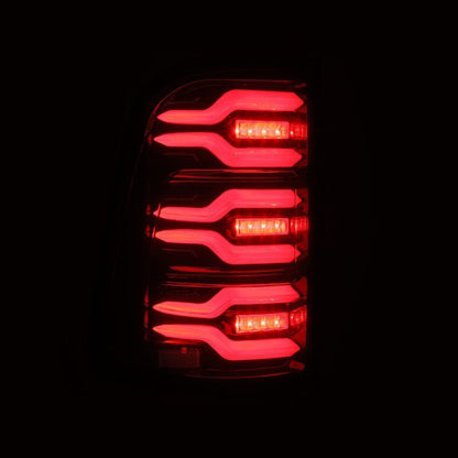 AlphaRex 19-21 Dodge Ram 1500 Luxx-Series LED Tail Lights Black/Red w/Activ Light/Seq Signal - B2B Diesel & Gas Service