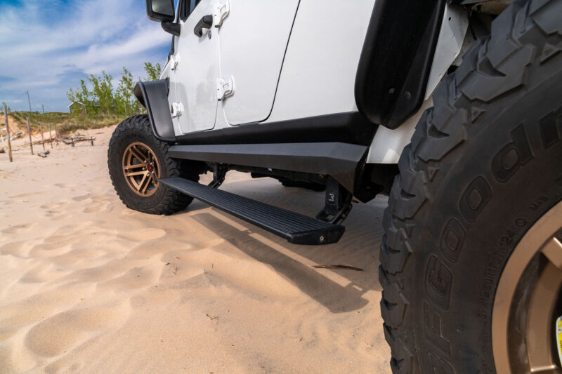 AMP Research 2007-2018 Jeep Wrangler JKU 4DR PowerStep XL - Black (Incl OEM Style Illumination) - B2B Diesel & Gas Service