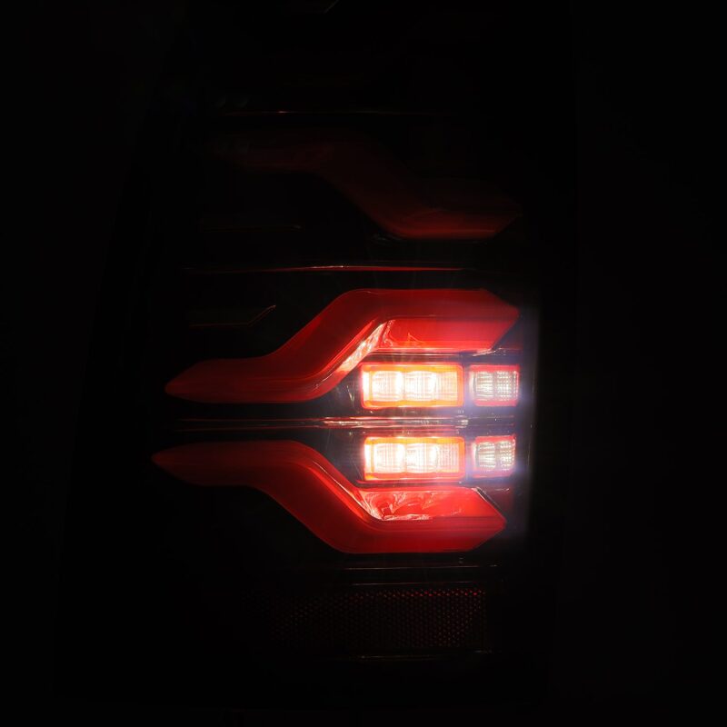 AlphaRex 05-15 Toyota Tacoma LUXX LED Taillights Blk/Red w/Activ Light/Seq Signal - B2B Diesel & Gas Service