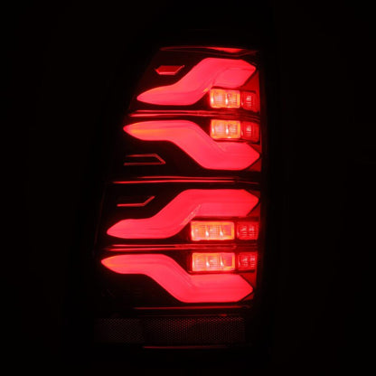AlphaRex 05-15 Toyota Tacoma LUXX LED Taillights Blk/Red w/Activ Light/Seq Signal - B2B Diesel & Gas Service