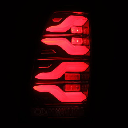 AlphaRex 05-15 Toyota Tacoma LUXX LED Taillights Blk/Red w/Activ Light/Seq Signal - B2B Diesel & Gas Service