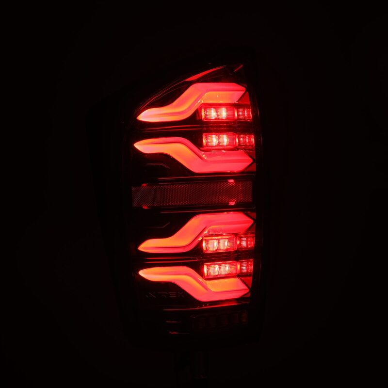 AlphaRex 16-21 Toyota Tacoma LUXX LED Taillights Alpha Blk w/Activ Light/Seq Signal - B2B Diesel & Gas Service